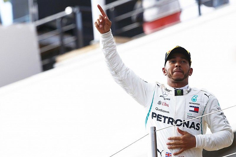 Lewis Hamilton, Mercedes AMG F1, celebrates on the podium after winning the race