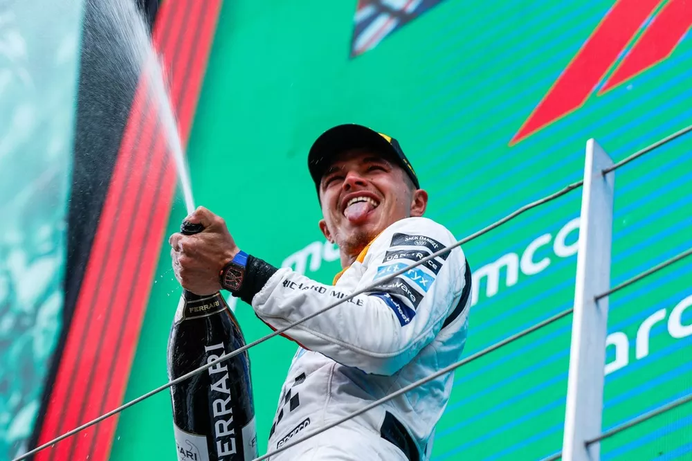 Lando Norris, McLaren, 2nd position, sprays Champagne on the podium
