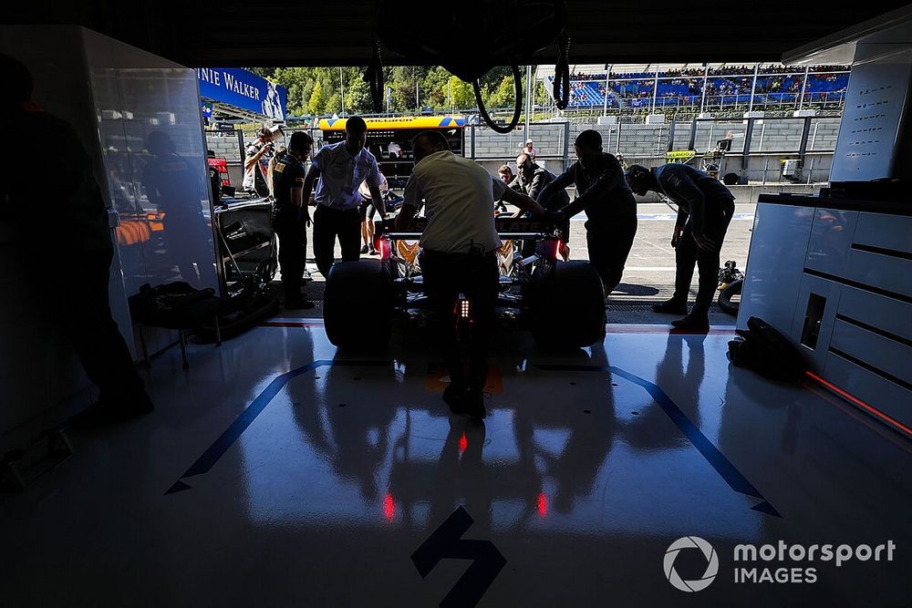 Lando Norris, McLaren MCL34, is returned to the garage