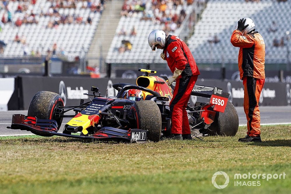 Marshals assists Pierre Gasly, Red Bull Racing RB15, after a crash