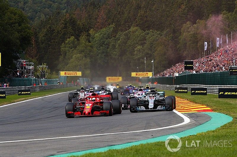 Sebastian Vettel, Ferrari SF71H, leads Lewis Hamilton, Mercedes AMG F1 W09, Sergio Perez, Racing Point Force India VJM11, and Esteban Ocon, Racing Point Force India VJM11, at the start