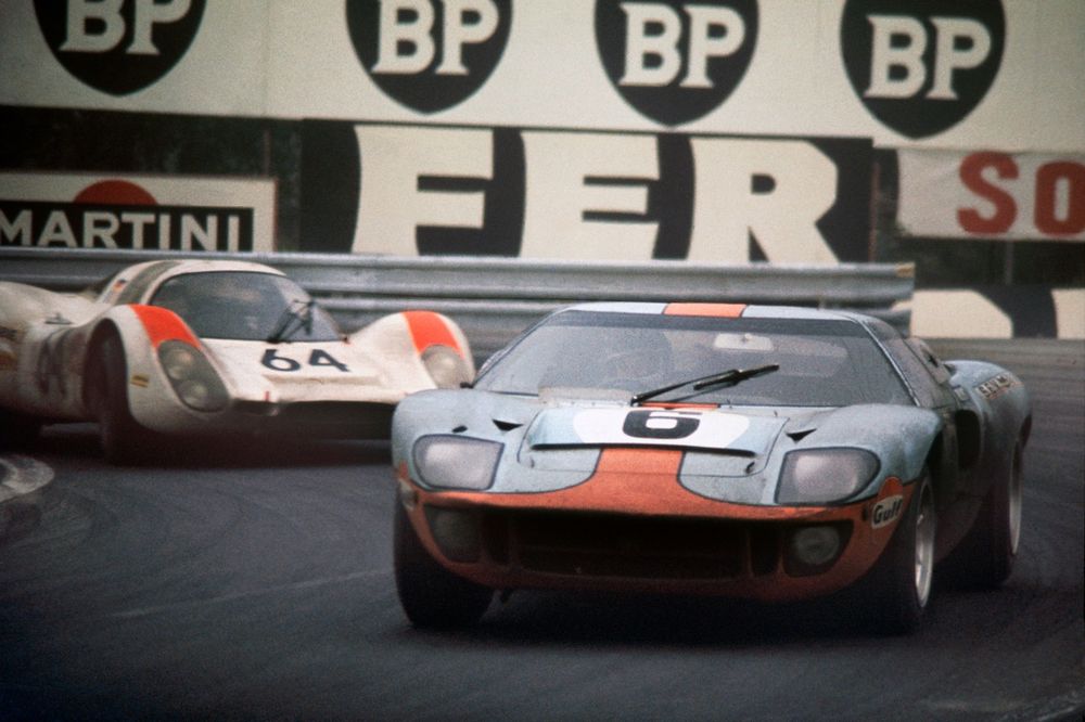 Jacky Ickx/Jackie Oliver (Ford GT40), 1st position, leads Hans Herrmann/Gerard Larrousse (Porsche 908), 2nd position