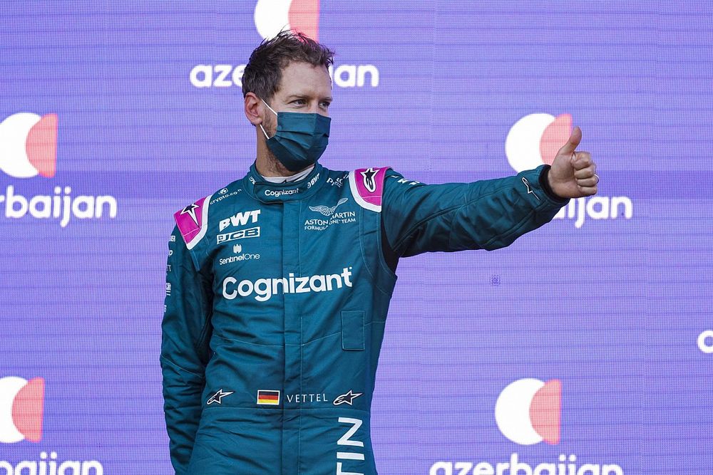 Sebastian Vettel, Aston Martin, 2nd position, gives a thumbs up on the podium