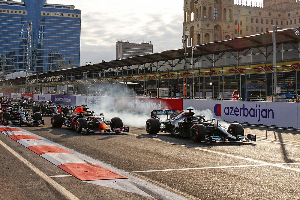 Lewis Hamilton, Mercedes W12, locks up at the restart and runs off the circuit whilst battling for the lead with Sergio Perez, Red Bull Racing RB16B