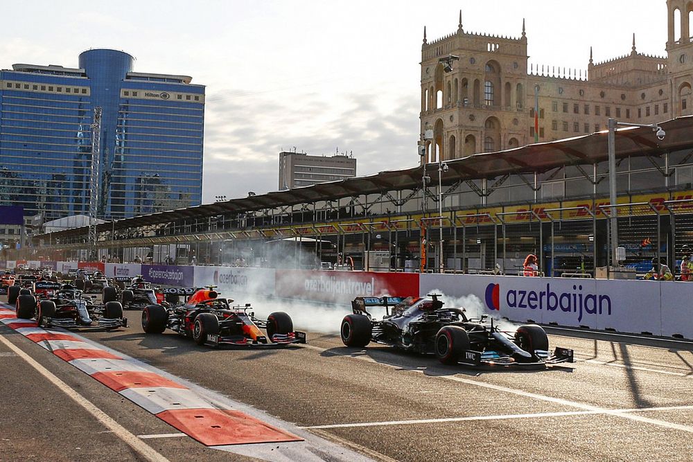 Lewis Hamilton, Mercedes W12, locks up at the restart and runs off the circuit whilst battling for the lead with Sergio Perez, Red Bull Racing RB16B