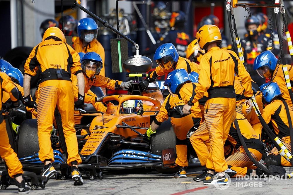 Lando Norris, McLaren MCL35, makes a pit stop