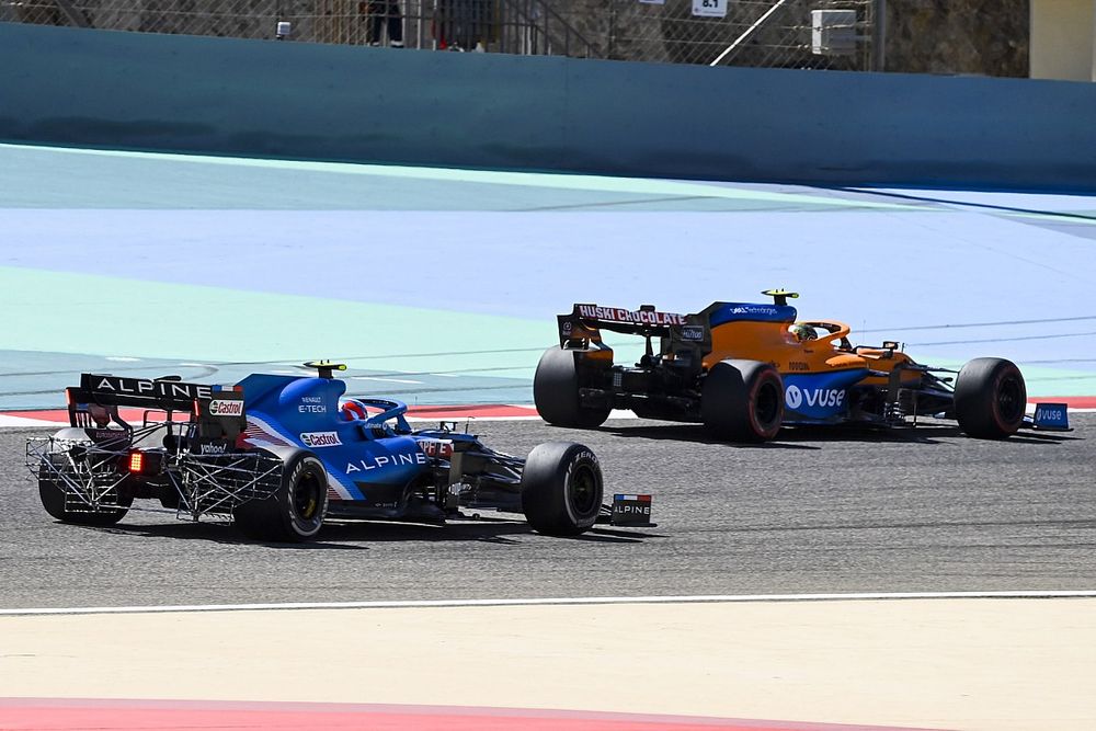 Esteban Ocon, Alpine A521 and Lando Norris, McLaren MCL35M 