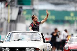Romain Grosjean, Haas F1 Team, waves from a Triumph Stag on the drivers parade