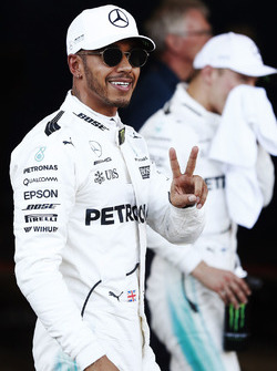 Lewis Hamilton, Mercedes AMG F1, celebrates his pole position in parc ferme, alongside Valtteri Bottas, Mercedes AMG F1