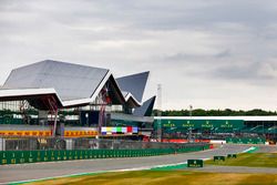 Clouds gather over the grid and the Wing pit building