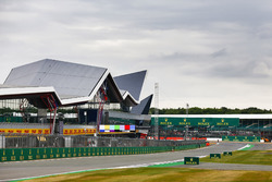 Clouds gather over the grid and the Wing pit building
