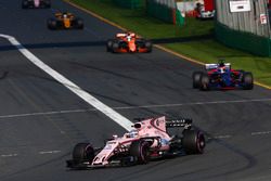 Sergio Perez, Force India VJM10, leads Daniil Kvyat, Scuderia Toro Rosso STR12, and Fernando Alonso,