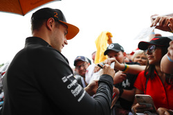Stoffel Vandoorne, McLaren, signs autographs for fans