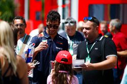 Daniel Ricciardo, Red Bull Racing, signs autographs for fans