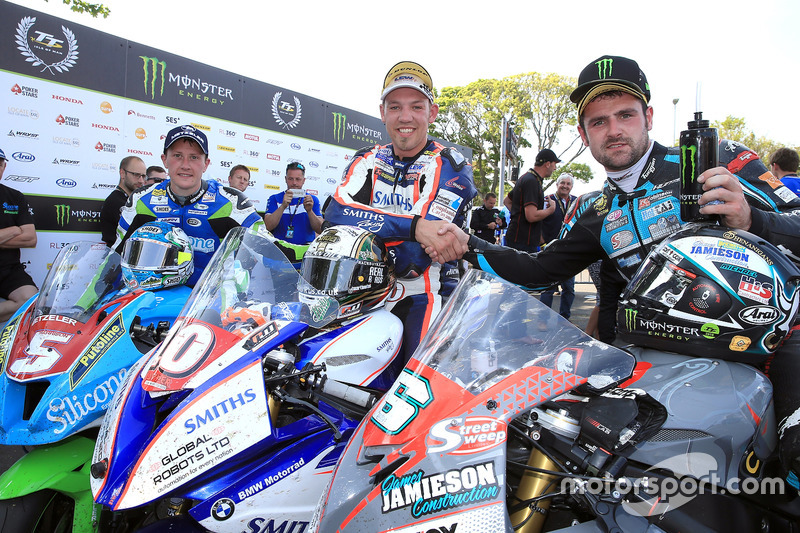RL360º Superstock TT race winner Peter Hickman celebrates with runner up Michael Dunlop and third pl