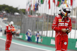 Sebastian Vettel, Ferrari, Kimi Raikkonen, Ferrari, walk back into the pits after qualifying