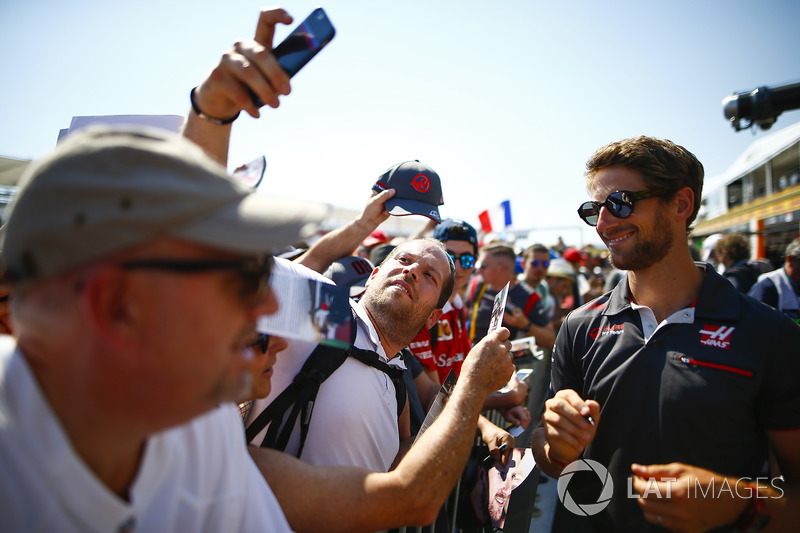 Romain Grosjean, Haas F1 Team, signs autographs and has his picture taken by fans