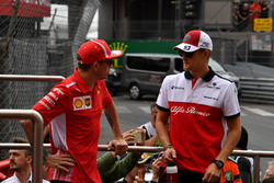 Kimi Raikkonen, Ferrari and Marcus Ericsson, Sauber on the drivers parade