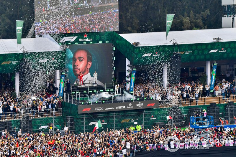 Sebastian Vettel, Ferrari, 2nd position, Lewis Hamilton, Mercedes AMG F1, 1st position, and Valtteri Bottas, Mercedes AMG F1, 3rd position, on the podium