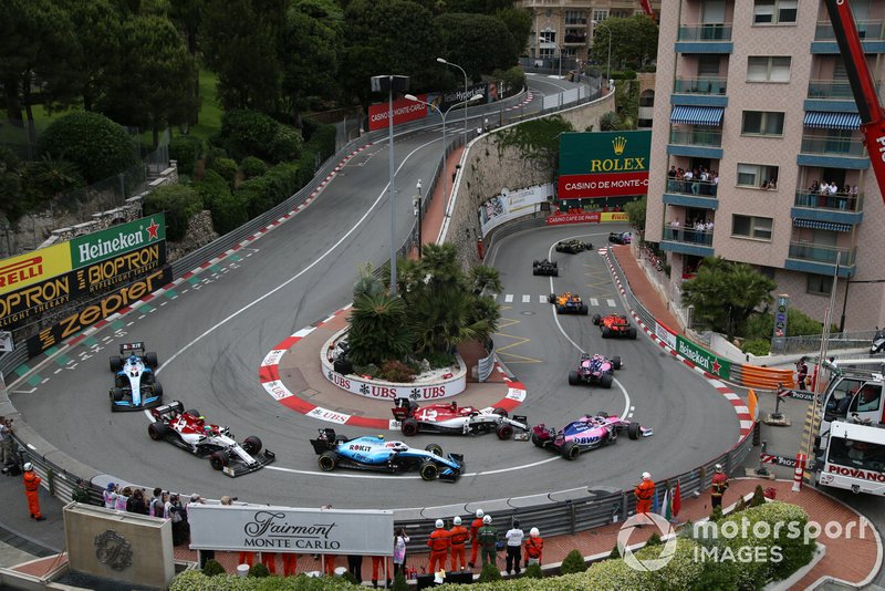 Romain Grosjean, Haas F1 Team VF-19, leads Lando Norris, McLaren MCL34, Charles Leclerc, Ferrari SF90, Lance Stroll, Racing Point RP19, Kimi Raikkonen, Alfa Romeo Racing C38, Sergio Perez, Racing Point RP19, Robert Kubica, Williams FW42, Antonio Giovinazzi, Alfa Romeo Racing C38, and George Russell, Williams Racing FW42