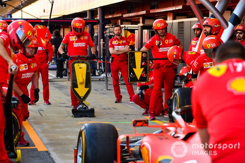 The Ferrari team practice a pit stop