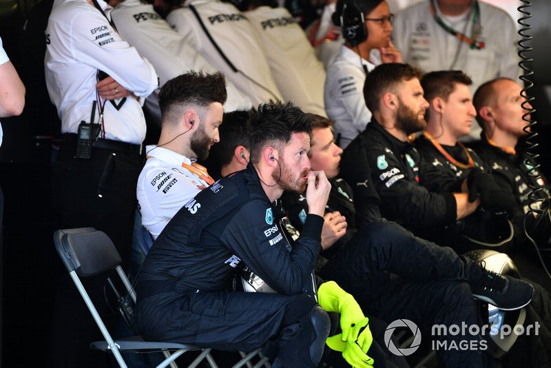 The Mercedes pit crew rest between stops