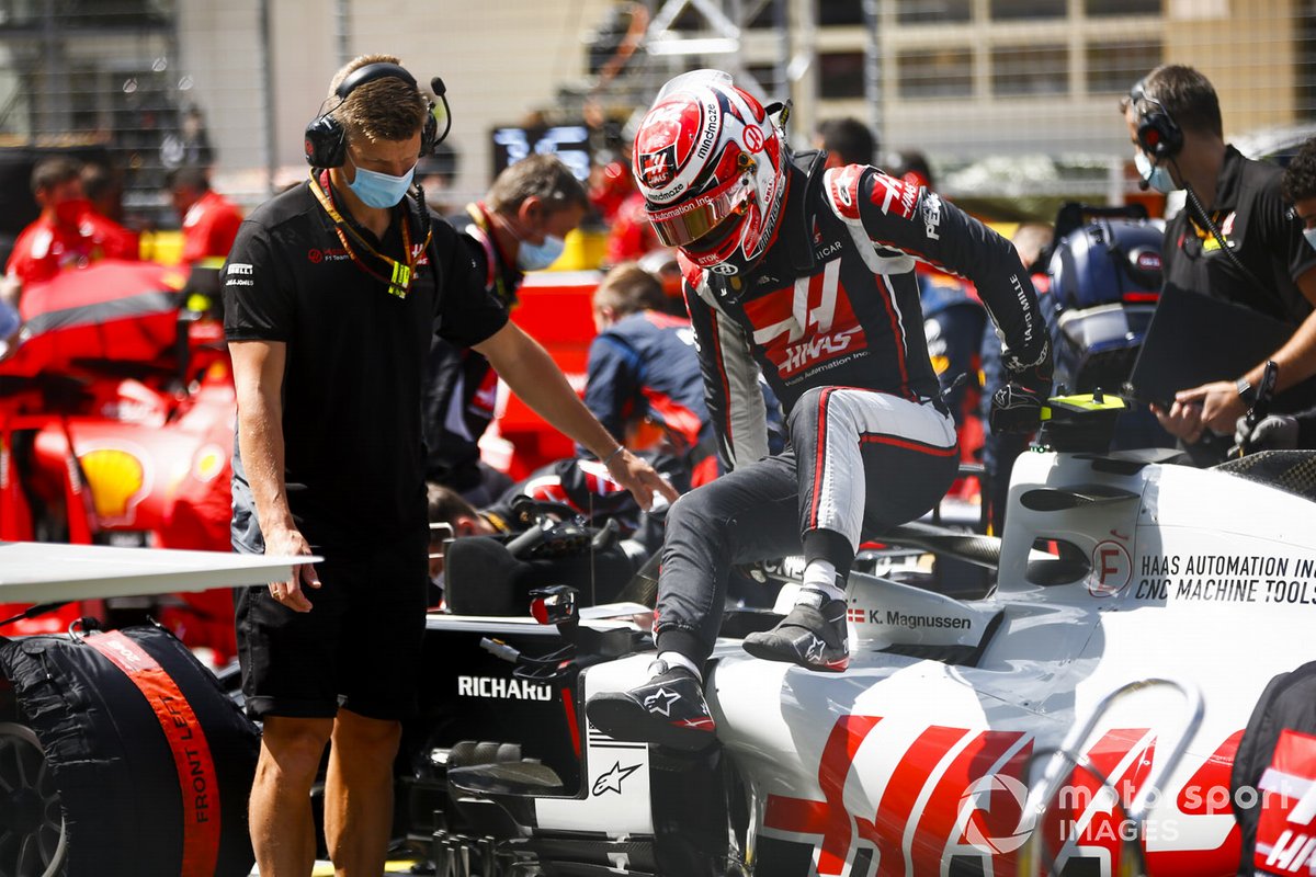 Kevin Magnussen, Haas F1, climbs out of his car on the grid