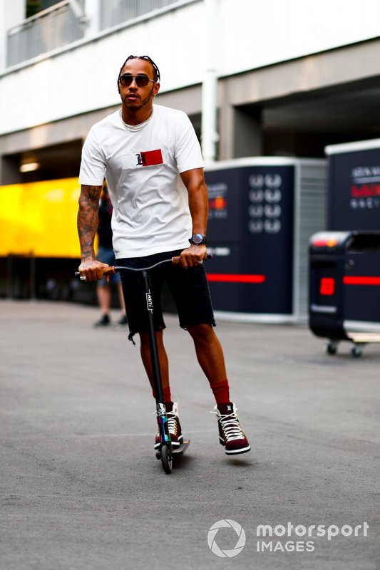Lewis Hamilton, Mercedes AMG F1 on a scooter in the paddock