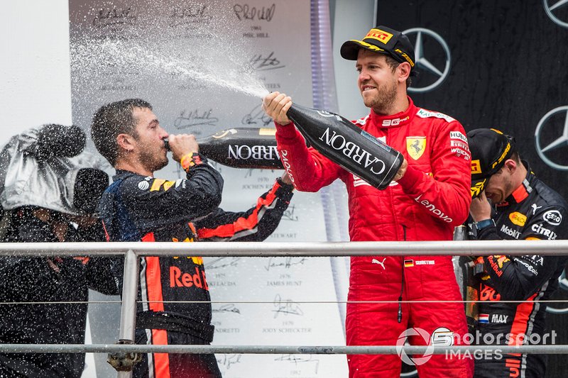 Sebastian Vettel, Ferrari, 2nd position, sprays Champagne on the podium