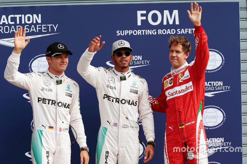 Qualifying top three in parc ferme (L to R): second place Nico Rosberg, Mercedes AMG F1; Pole positi