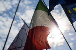 The flags of Monza, Italy and Europe