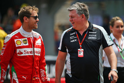 Sebastian Vettel, Ferrari with Otmar Szafnauer, Sahara Force India F1 Chief Operating Officer