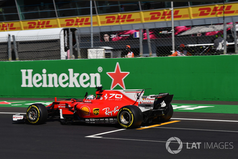 Sebastian Vettel, Ferrari SF70H celebrates as he crosses the line for third