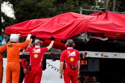 The crashed Ferrari SF70H of Kimi Raikkonen, Ferrari is recovered back to the pits on the back of a