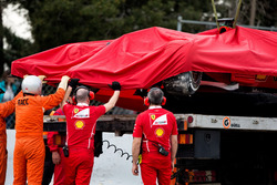 The crashed Ferrari SF70H of Kimi Raikkonen, Ferrari is recovered back to the pits on the back of a