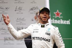 Lewis Hamilton, Mercedes AMG, celebrates taking victory on the podium