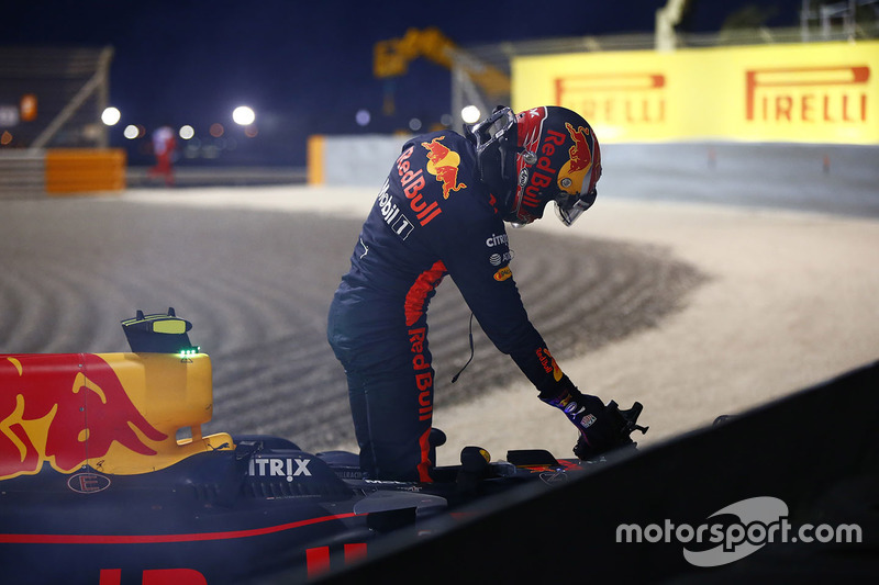 Max Verstappen, Red Bull Racing, climbs out of his car after retiring