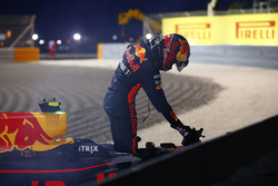 Max Verstappen, Red Bull Racing, climbs out of his car after retiring