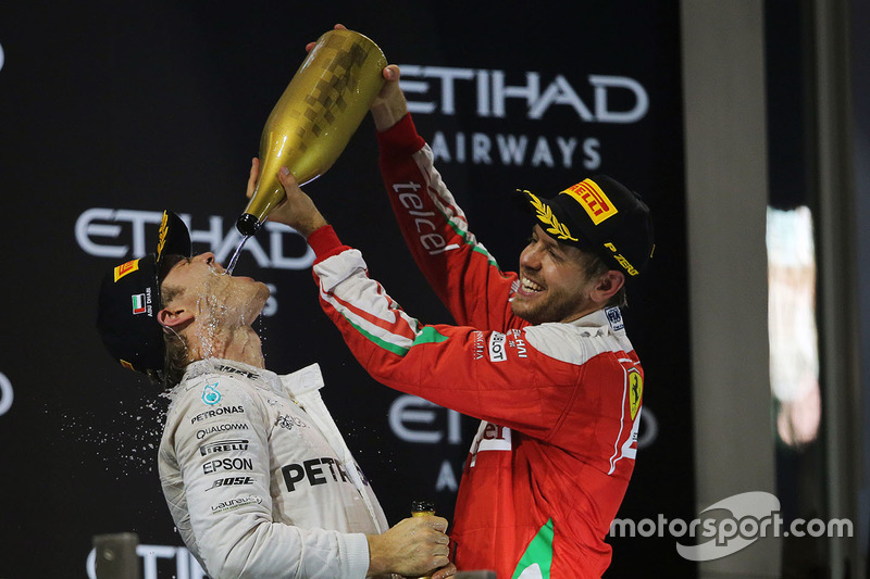 Second place Nico Rosberg, Mercedes AMG F1 celebrates his World Championship on the podium with Seba