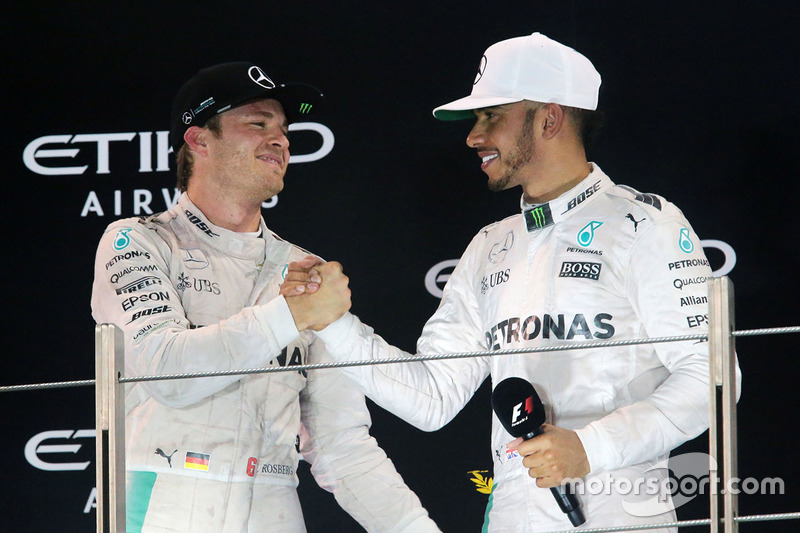 The podium: second place Nico Rosberg, Mercedes AMG F1 celebrates his World Championship with race winner and team mate Lewis Hamilton, Mercedes AMG F1