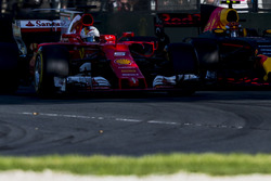 Sebastian Vettel, Ferrari SF70H, battles with Max Verstappen, Red Bull Racing RB13