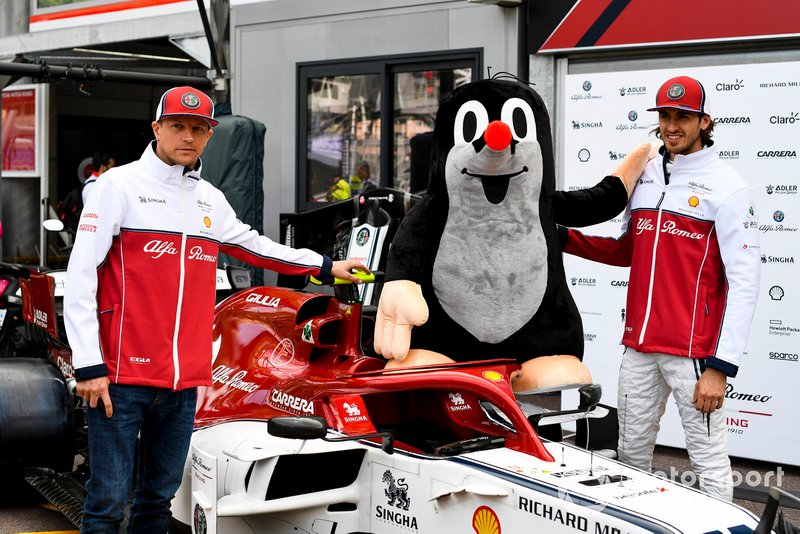 Kimi Raikkonen, Alfa Romeo Racing and Antonio Giovinazzi, Alfa Romeo Racing pose for a photograph with a mole