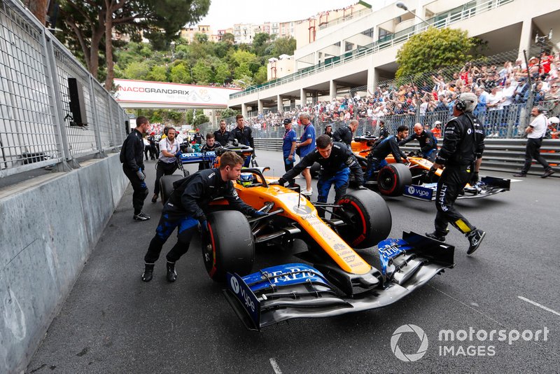 Lando Norris, McLaren MCL34, and Carlos Sainz Jr., McLaren MCL34, arrive on the grid