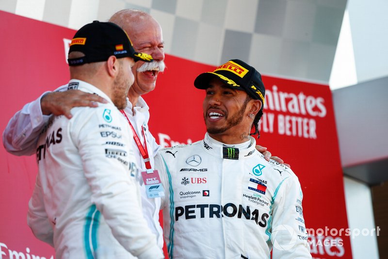 Valtteri Bottas, Mercedes AMG F1, 2nd position, Dr Dieter Zetsche, CEO, Mercedes Benz, and Lewis Hamilton, Mercedes AMG F1, 1st position, celebrate on the podium