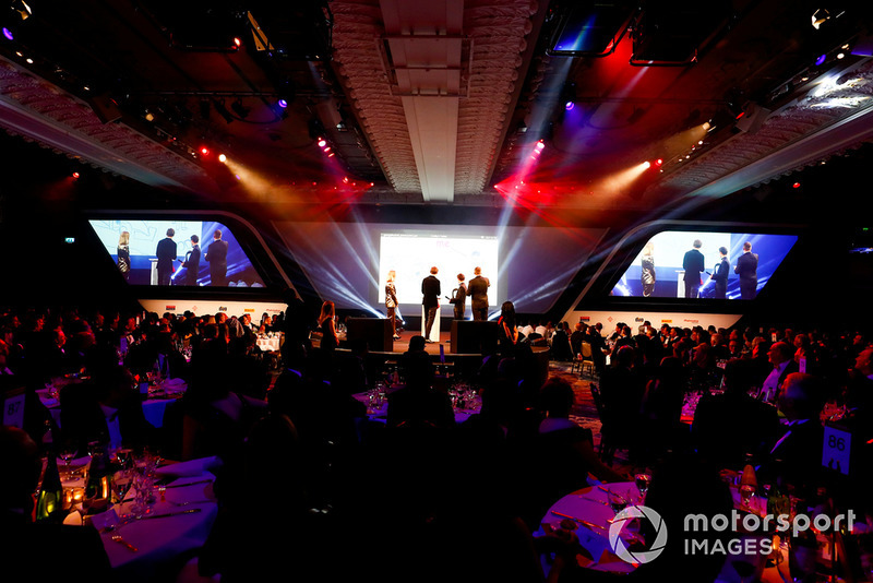 Williams F1 Driver George Russell, and McLaren F1 driver Lando Norris on stage with hosts Nicki Shields and David Croft