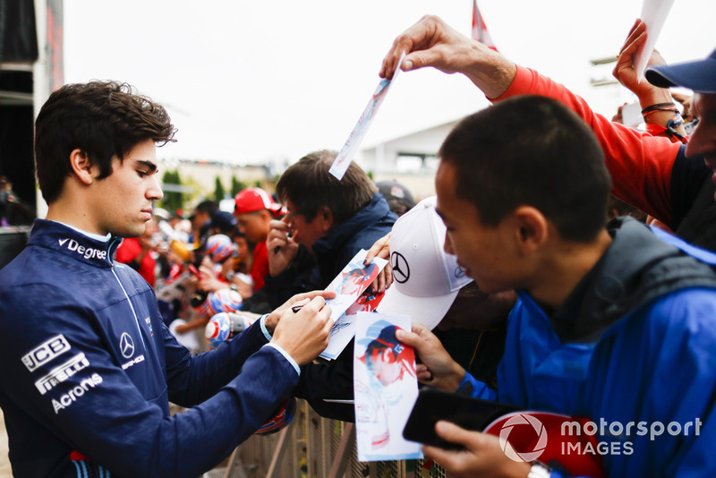 Lance Stroll, Williams Racing, signs autographs for fans