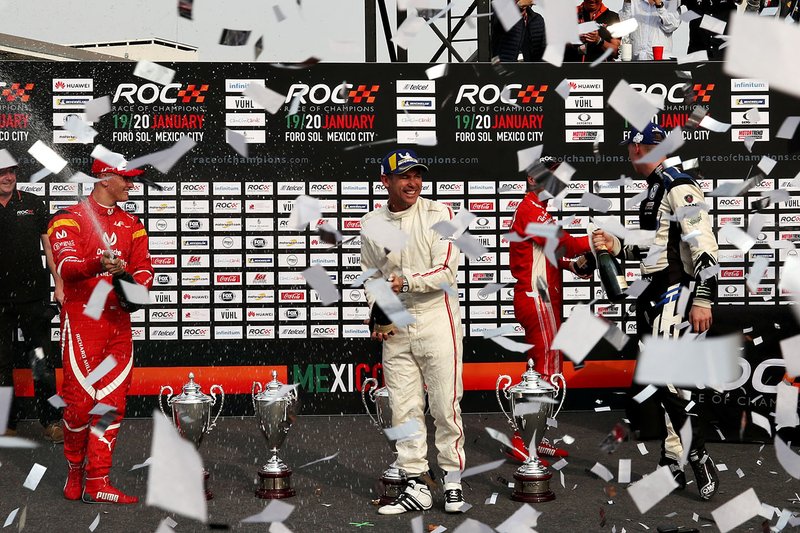 Tom Kristensen, Johan Kristoffersson celebrate winning with runners up Sebastian Vettel and Mick Schumacher on the podium