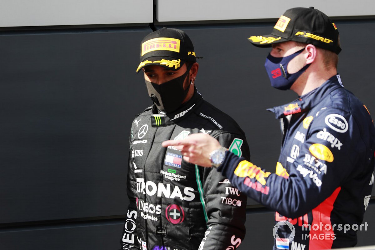 Lewis Hamilton, Mercedes-AMG F1, 1st position, and Max Verstappen, Red Bull Racing, 2nd position, talk after the race