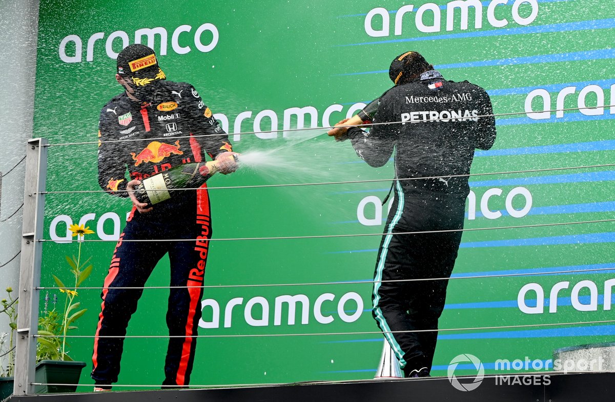 Max Verstappen, Red Bull Racing, 2nd position, and Lewis Hamilton, Mercedes-AMG Petronas F1, 1st position, on the podium