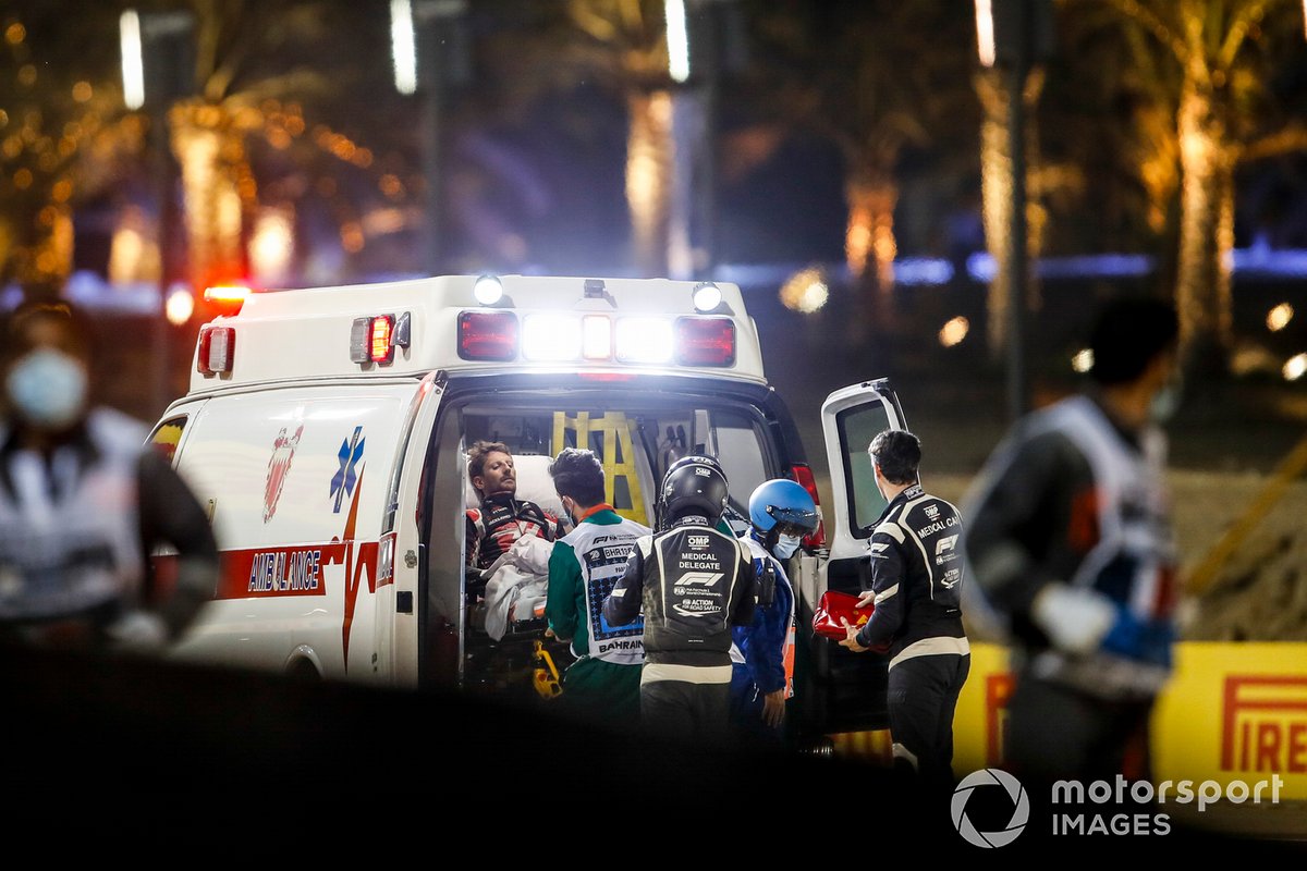 Romain Grosjean, Haas F1, is loaded into an ambulance after his huge crash on the opening lap